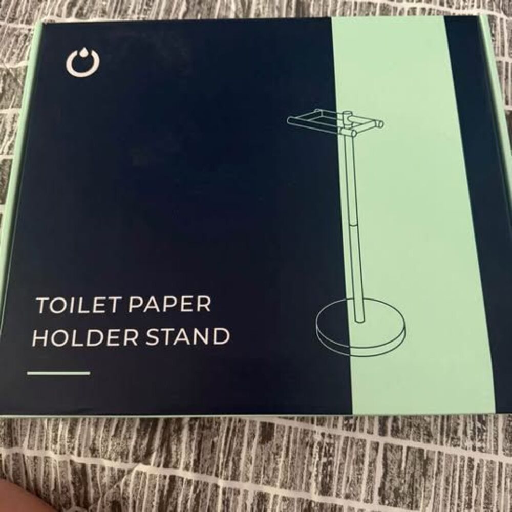 New in box toilet paper holder
